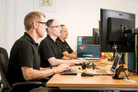 Modern Networks IT support engineers working on the Service Desk in the company's Exeter office