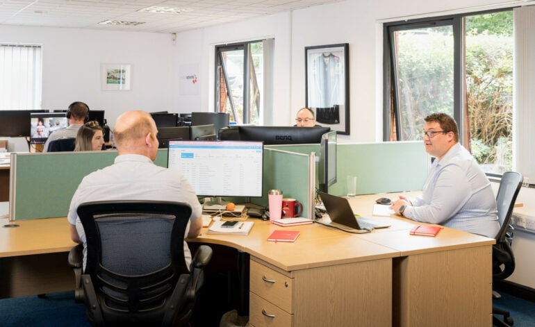 The Modern Networks IT support services, a photograph of the sales and management teams at work in the company's Exeter office