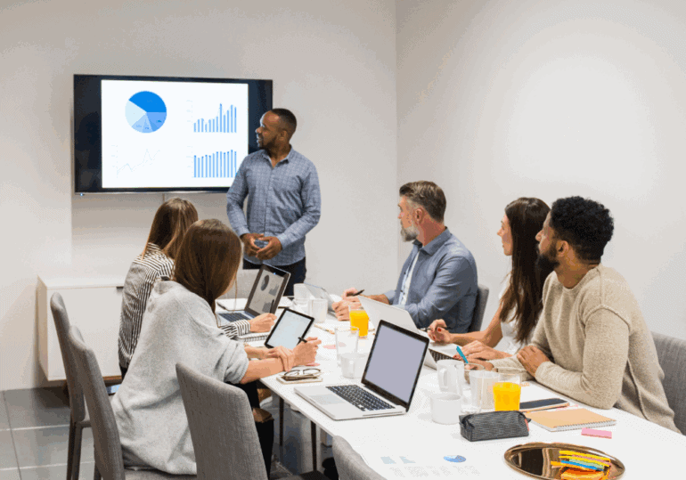 SMEs adopt AI tools high-tech meeting in office boardroom