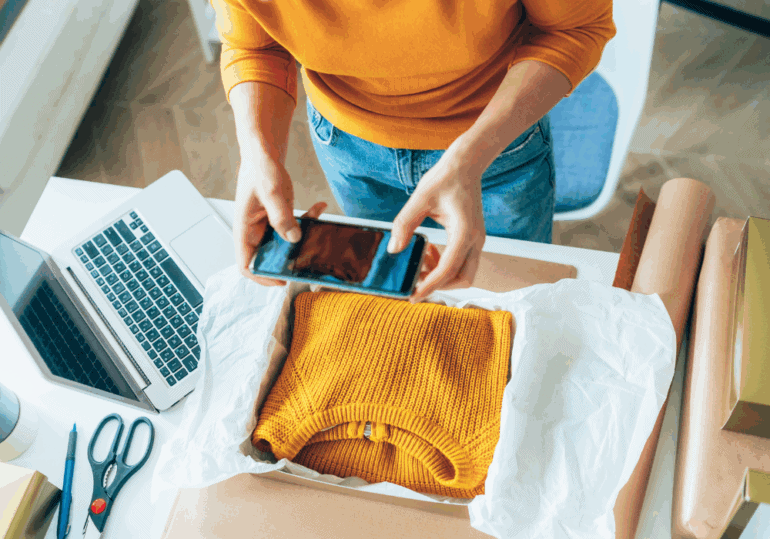 small business owner prepares a delivery small business owner packs a parcel for delivery