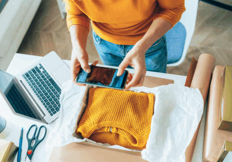 small business owner prepares a delivery small business owner packs a parcel for delivery