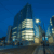 three snowhill office building at night with tram lines in foreground
