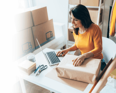 sme hero image small business owner managing deliveries using a computer