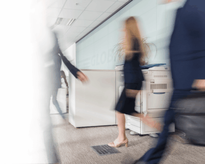  busy office corridor with a multi-function printer displayed in the background