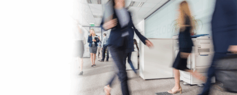  busy office corridor with a multi-function printer displayed in the background